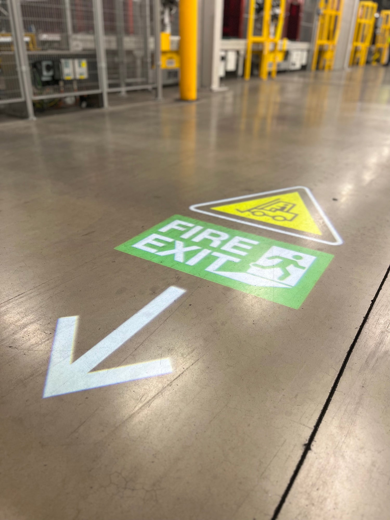 Bespoke safety signage featuring a forklift safety sign, fire exit sign and way finding signage.