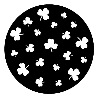 Multiple white shamrock silhouettes in different sizes and orientations on a black circle gobo.